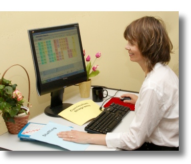Woman at desk Offering TimeTabler Help